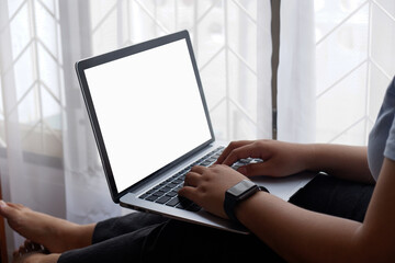 Woman holds tablet in hands. Morning online activities in home. Relax in sofa, watching movies and TV shows on mobile device. Social media addiction. Work at home, freelance. Technology in lifestyle
