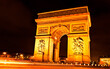 Arc de Triomphe in Paris illuminated with lights in the night...