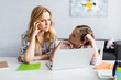 © LIGHTFIELD STUDIOS - Selective focus of kid looking at thoughtful mother near laptop at home