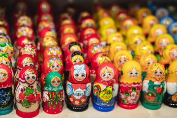 Wall Mural - Wooden Nesting Dolls or Russian Matryoshka Dolls for sale in St Petersburg, Russia, Matryoshka dolls - traditional Russian souvenirs for foreign tourists