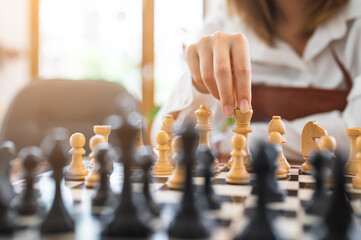 Woman playing chess in club. concept of competition and decision