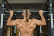 © Javier Pardina/Stocksy - Strong and healthy man working out inside a crossfit gym.