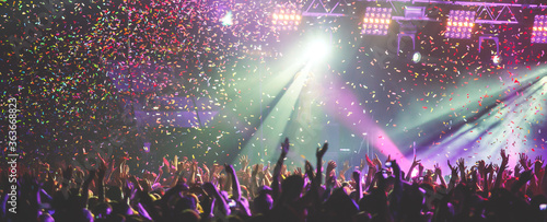 Cuadros en Lienzo A crowded concert hall with scene stage lights, rock show performance, with peop