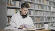 © stanis88 - Tired student is preparing for examination at university library