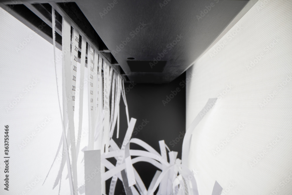 Shredding documents using paper shredder Stock Photo | Adobe Stock