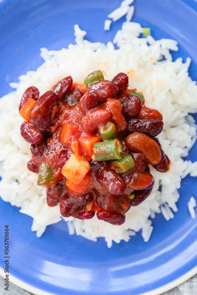 Plate with tasty rice, beans and vegetables, closeup
