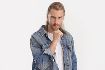 Canvas Print - Handsome man with stylish hairdo on light background