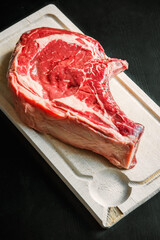 Wall Mural - Beef prime rib on a cutting board