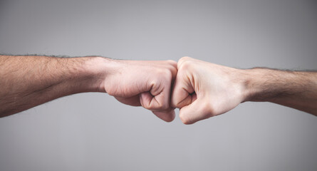 Wall Mural -  Close-up. Two fists hitting each other. Fight