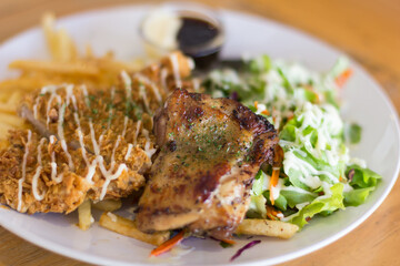 Wall Mural - Fried pork chop, boiled potatoes and vegetable salad