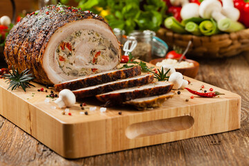 Wall Mural - Baked whole bacon. Roulade with minced meat, mushrooms and paprika.