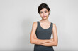 © Ranta Images - Portrait of young beautiful teenage girl with arms crossed