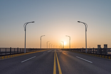 Wall Mural - road on bridge in sunrise