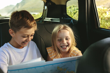 Wall Mural - Kids  playing with map in car