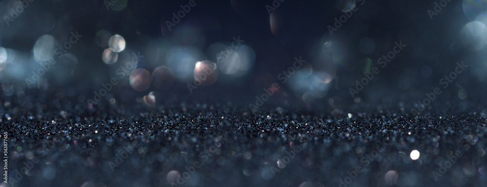 Abstract dark blue background with blurred silver bokeh. Horizontal background with short depth of field for religious rituals and spiritual meditation or grief. - obrazy, fototapety, plakaty 