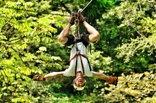 Full Length Of Young Man On Zip Line