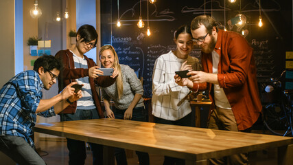Wall Mural - great concept for augmented reality mock-up. three young developers look at augmented reality throug