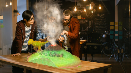 Wall Mural - two young developers look at dinosaur and volcano eruption in augmented reality through smartphone. 