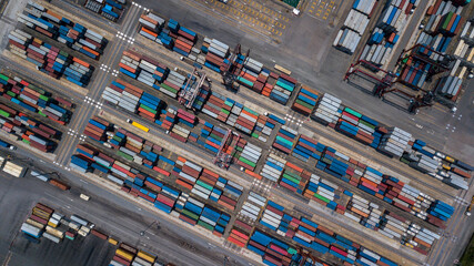 Wall Mural - Aerial view of area with stacked containers at the port, Top view stack of freight containers in rows at the shipyard, Global business cargo logistics shipping industry export import transportation.