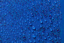Blue Water Drops On Glass
