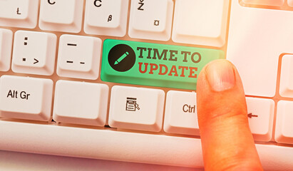 Wall Mural - text sign showing time to update. business photo text system software update for enhancement or comp