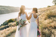 Lesbian wedding couple in white dresses