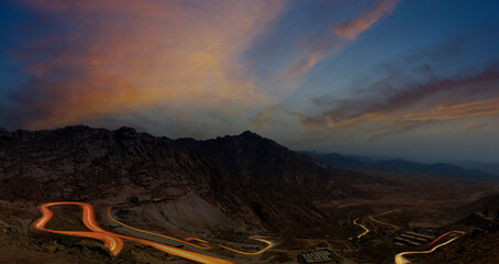 Al Hada Mountains near Taif, dangerous Al Hada road mountain pass with night  time head light trails, in western Saudi Arabia