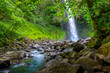 La Fortuna Waterfall in the forest with river, close to Arenal Volcano, Costa Rica national park. Central America.