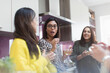 © Sam Edwards/Caia Image - Women talking and drinking tea in kitchen