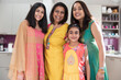 © Sam Edwards/Caia Image - Portrait happy multigenerational Indian women in traditional saris