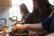 © Sam Edwards/Caia Image - Indian women cooking food in kitchen