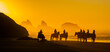 Horseback riders on the beach at Bandon, on the southern Oregon coast,  at sunset