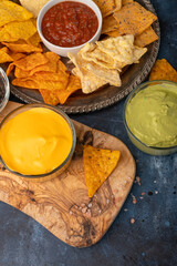 Snacks and chips close-up with salsa or diploma for potato or pita chips, relaxing and watching football or movies