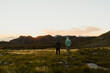 © Kevin - Two men in mountains watching sunset