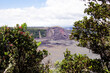 Panoramic view from edge of Kilauea Iki Volcano crater and caldera with lava rock flow field and vegetation inside Volcanoes National Park on Big Island in Hawaii