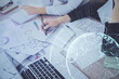 © peshkova - Social network theme hologram over hands taking notes background. Concept of global international people connect. Double exposure