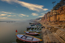 Early Morning View Of Famous Ghats Of Varanasi Where Wooden Boats Lined Up 