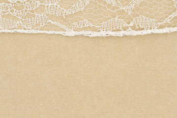 Wall Mural - Delicate lace textured material on beige paper background