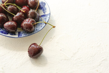 On a white background sweet cherry. Place for photo.
