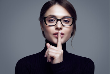 Cute student girl wearing black turtleneck sweater and stylish eyeglasses