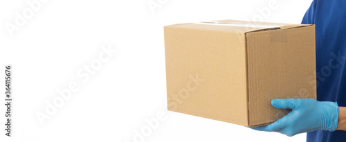 Download Closeup Delivery Man Hand In Medical Gloves Holding Cardboard Box Isolated On White Banner Background Packaging Mockup Delivery Service Concept Buy This Stock Photo And Explore Similar Images At Adobe Stock
