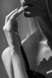 © Julia - girl sensually and sexually touches her lips, close-up, black and white, shadows,