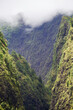Pu´u or Puu Kukui Mountain summit inside Iao Valley State Park on tropical Island of Maui in Hawaii with lush evergreen rainforest vegetation