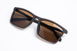 © Teerapong - Sunglasses with brown lenses on white isolated background. female or male , fashion
