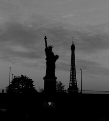 Image of statue of liberty and eiffel tower together.