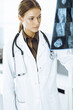 © Iryna - Woman-doctor examining x-ray picture in hospital. Orthopedist at work in clinic. Medicine and healthcare concept
