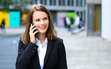 Portrait of a young woman talking on the phone