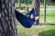 © Hennadii - Young guy has a rest in summer in a hammock