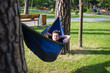 © Hennadii - Young guy has a rest in summer in a hammock