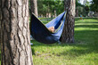 © Hennadii - Young guy has a rest in summer in a hammock